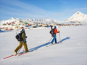 Ski mountaineers crossing the frozen Kong Oscar Fjord