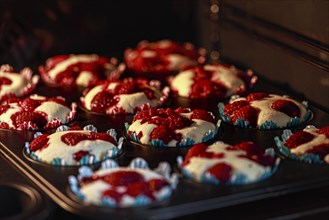 Raspberry muffins in a muffin tin