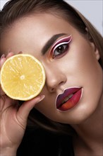 Beautiful caucasian woman with creative makeup and purple lips. Beauty face. Art makeup