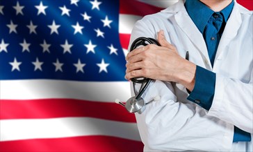 Doctor with stethoscope on USA flag. Health and care with the flag of United State. USA national health concept