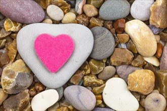 Stone heart and pink fabric heart