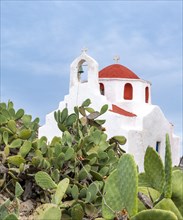 Small Cycladic white and red Orthodox chapel