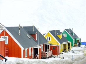 Colourful wooden houses in Tasiilaq in winter