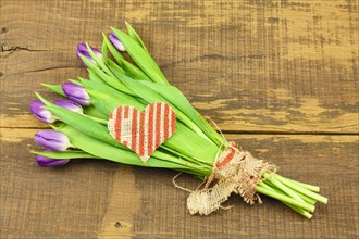 Bouquet of Tulips on Wooden Background and Heart