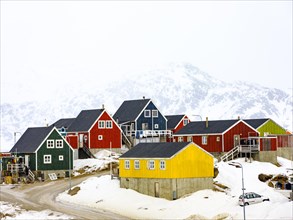 Colourful wooden houses in Tasiilaq in winter
