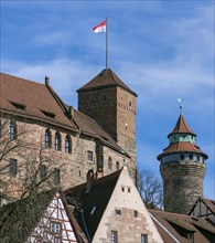 Sinwell Tower and Imperial Castle with waving city flag