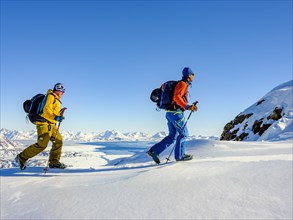 Climbers climb over ice on the local mountain