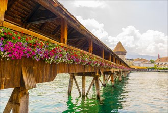 City of Lucerne with Chapel Bridge and Flowers in a Sunny Day in Switzerland