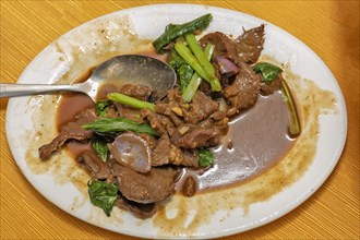 Chopsuey of lamb pieces on plate