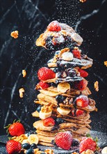 Pancakes stacked with strawberries