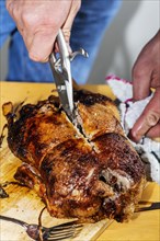 Grilled duck is expertly carved