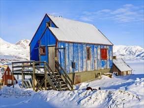 Old colourful wooden house in Tasiilaq in winter