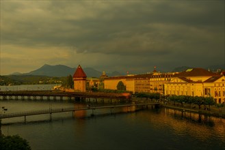 Aerial View over City of Lucerne with Chapel Bridge in a Sunny Day with Overcast Clouds in Switzerland