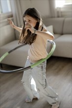 Girl gymnastics with hula hoop
