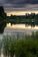 The lake Windgfaellweiher at sunset