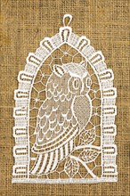 Crocheted Owl on Linen Background