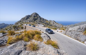 Car at the mountain pass with switchbacks to Sa Colobra