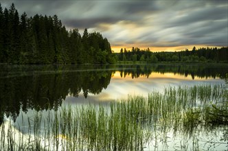 The lake Windgfaellweiher at sunset