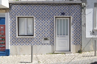 House facade with traditional tile pattern in the old town of Lagos