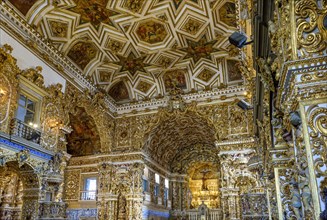 Interior of a historic gold-leafed baroque church in Pelourinho in the city of Salvador