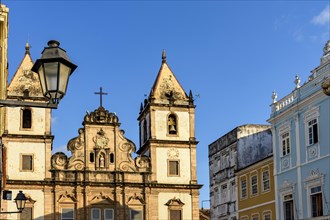 Facade of old and historic churches and houses in colonial and baroque style in the tourist center of Pelourinho