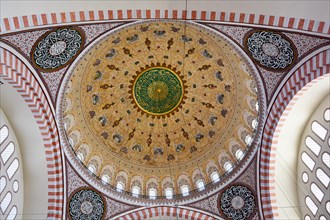 Ceiling and interior of the famous Blue Mosque in Istanbul with its ancient and colorful archs and mosaics