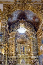 Altar of a historic gold-leafed baroque church in Pelourinho in the city of Salvador