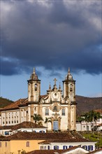 Facade of imposing and old historic church in baroque style in downtown Ouro Preto