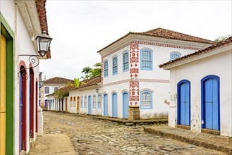 Streets of cobblestone and old houses in colonial style on the streets of the old and historic city of Paraty founded in the 17th century on the coast of the state of Rio de Janeiro
