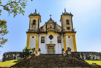 Ancient stairs and historic church of 18th century colonial architecture on top of the hill in the city of Ouro Preto in Minas Gerais