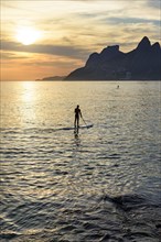 Stand up paddle at Ipanema beach in Ipanema during sunset