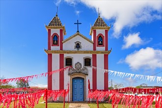 Small colonial-style chapel decorated with ribbons for a religious celebration in the small town of Lavras Novas