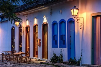 Street and colonial style houses illuminate at night in the city of Paraty on the coast of Rio de Janeiro
