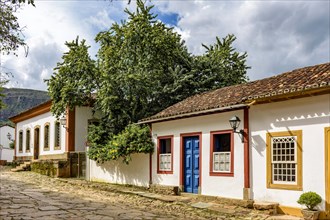 View of old colorful colonial houses on a cobbled street in the historic city of Tiradentes in Minas Gerais