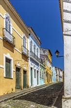 Cobbled streets and slopes and colorful colonial-style historic houses in the Pelourinho district of Salvador