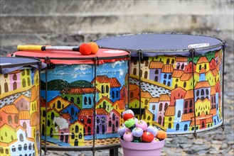 Ethnic and colorful decorated set of drums hand made painted on the streets of Pelourinho
