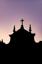 Silhouette of a colonial-style historic church during sunset in the Pelourinho neighborhood in the city of Salvador