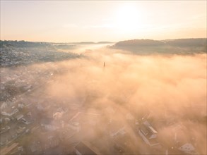 City in the fog at sunrise