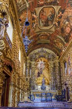 Interior and altar of a brazilian historic ancient church from the 18th century in baroque architecture with details of the walls in gold leaf in the city of Rio de Janeiro