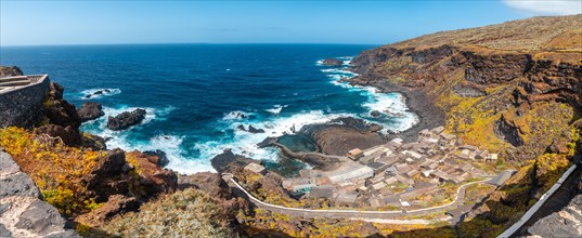Panoramic of the fishing village of Pozo de las Calcosas on the island of Hierro and the cliffs. Canary Islands