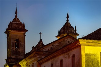 Back view at night of old and historic church in colonial architecture from the 18th century in the city of Ouro Preto in Minas Gerais