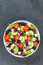 Greek salad with fresh tomatoes olives and feta cheese healthy eating food from above on slate with text free space in Stuttgart