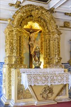 Altar of ancient and historic baroque church gold leaf with the image of Jesus Christ in the city of Salvado in Bahia
