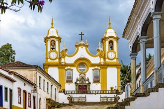 Colorful colonial houses and historic church facade in the famous city of Tiradentes founded in 1702 in the state of Minas Gerais