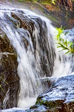 Small waterfall with water running on rocks in Carrancas