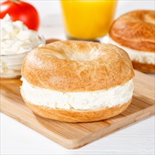 Bagel sandwich for breakfast topped with cream cheese square in Stuttgart