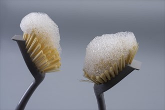Two cleaning brushes with foam