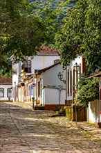 Slope with stone pavement and old colorful houses in colonial style in the city of Tiradentes in Minas Gerais