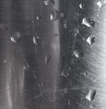 Water drops on grey steel texture background