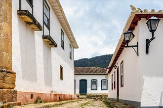 Cobblestone street in the historic city of Tiradentes in Minas Gerais among old colonial style houses